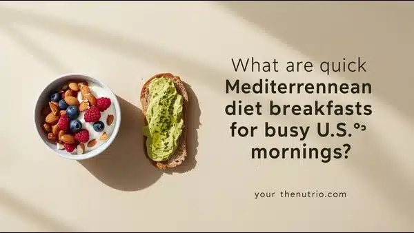 Flat-lay of Greek yogurt with mixed berries and chopped almonds alongside avocado toast on a marble countertop.