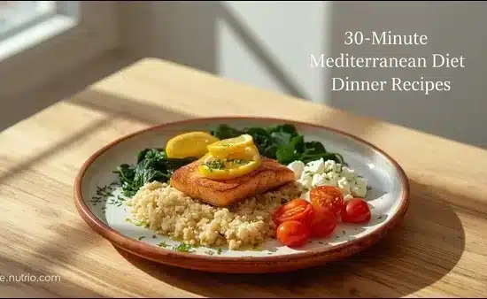 Wooden table with grilled salmon fillet, lemon slices, quinoa, wilted spinach, cherry tomatoes & feta, sunlight from window